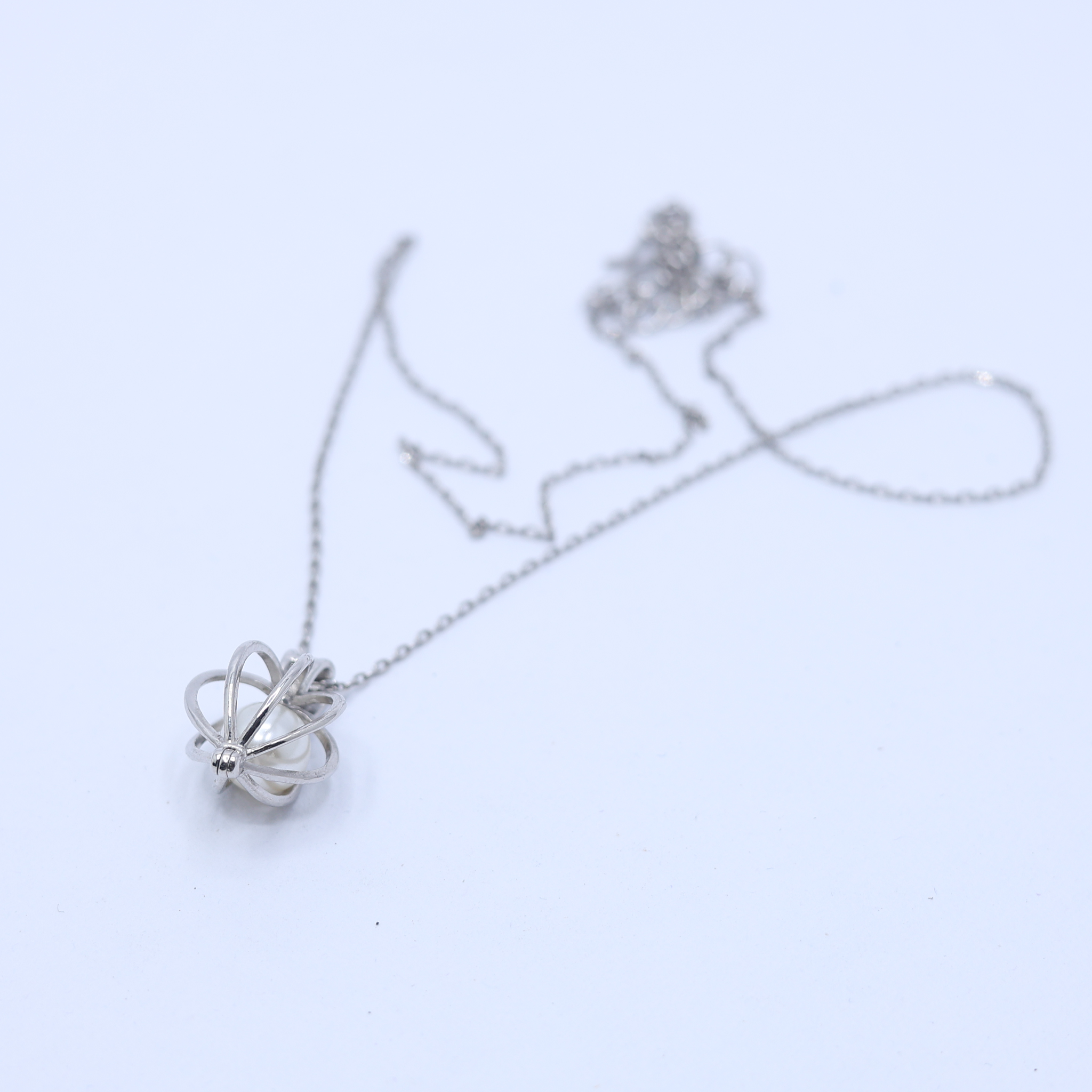Enclosed Pearl Charm Pendant