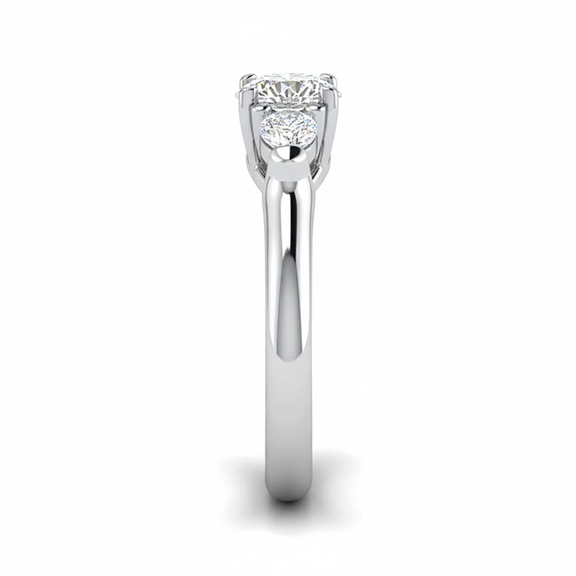 Round and Pear Three Stone Ring